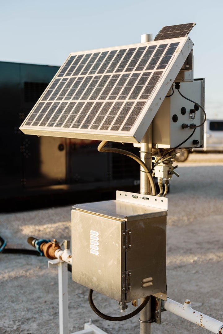 Small solar panel and electrical box outside of EnergyX container